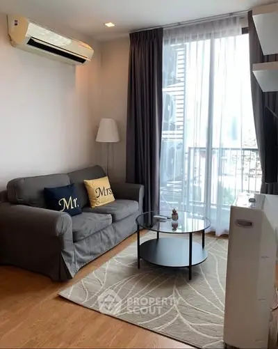 Cozy living room with modern decor and large window view