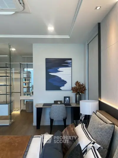 Modern bedroom with stylish decor and glass partitioned study area