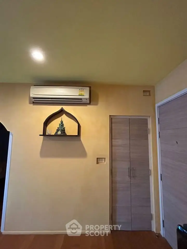 Cozy interior with air conditioning and wooden doors, perfect for modern living.