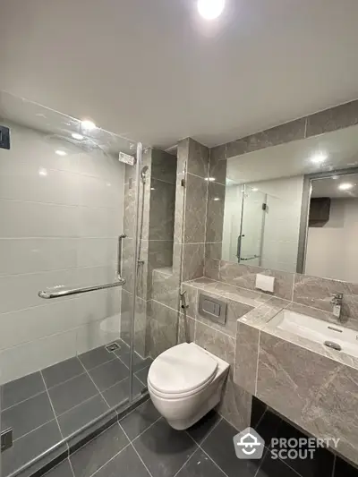 Modern bathroom with sleek design and glass shower enclosure