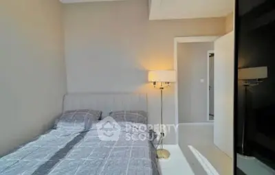 Cozy bedroom with modern decor and soft lighting