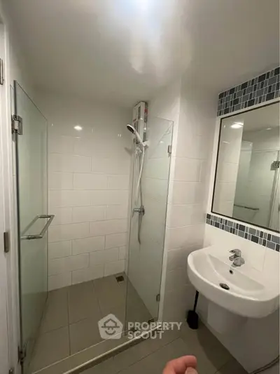 Modern bathroom with glass shower and sleek sink design