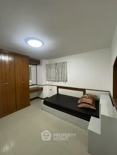 Cozy bedroom with built-in wardrobe and minimalist design