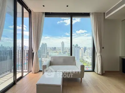 Stunning high-rise living room with panoramic city views and modern decor.