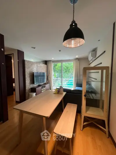 Modern living room with dining area and large window view