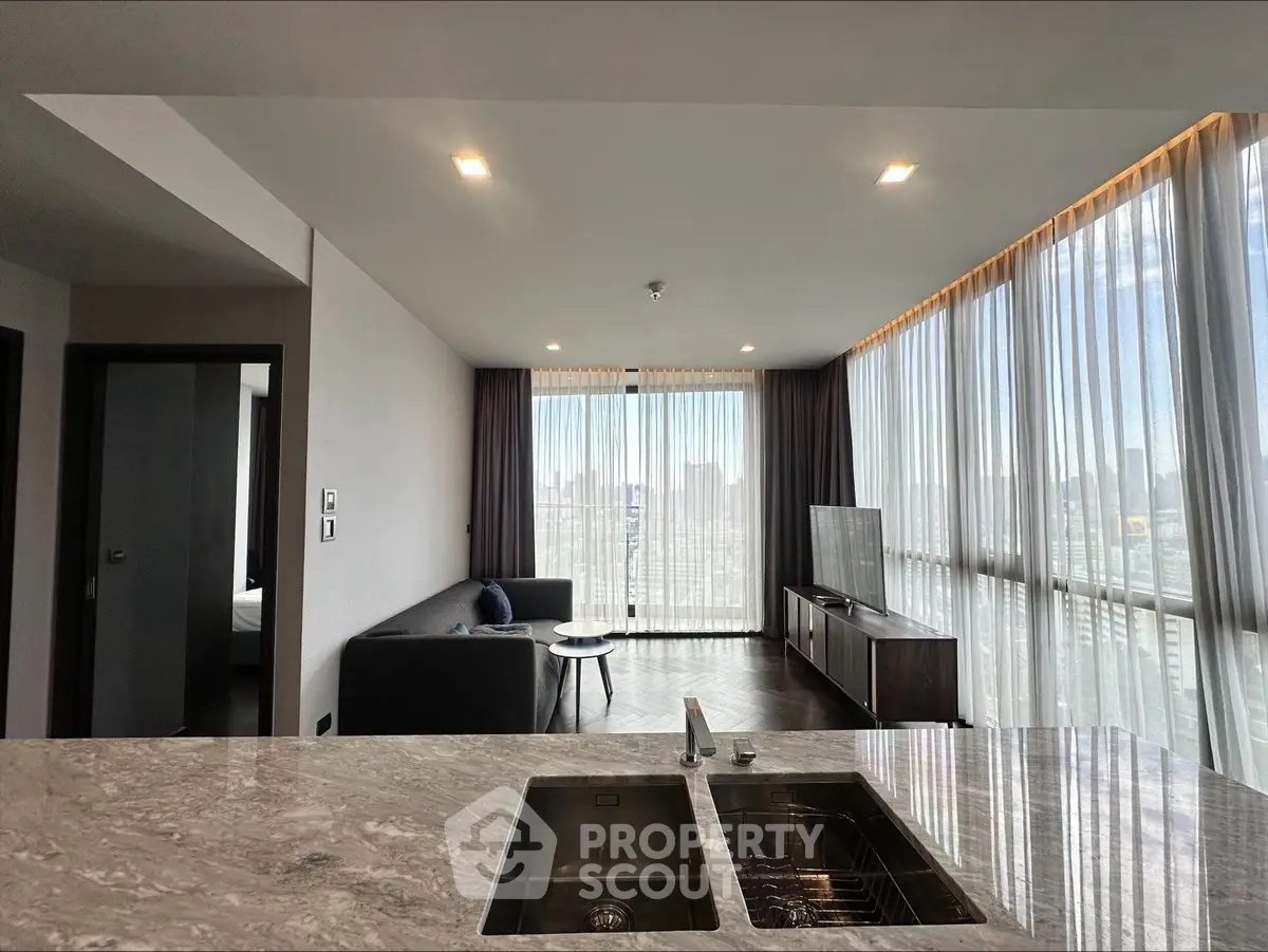 Modern living room with panoramic city view and sleek marble countertop
