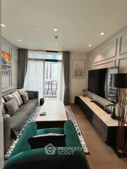 Luxurious living room with modern decor, large TV, and elegant furniture, perfect for relaxation and entertainment.