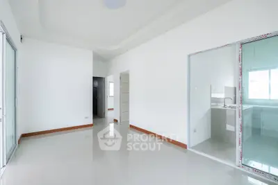 Spacious modern interior with sleek tile flooring and sliding glass doors