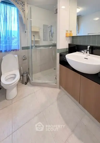 Modern bathroom with glass shower and elegant sink design