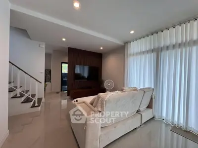Spacious modern living room with elegant decor and natural light