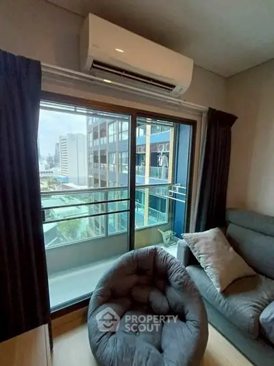 Modern living room with balcony view in urban apartment