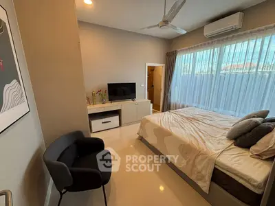 Modern bedroom with stylish decor and natural light