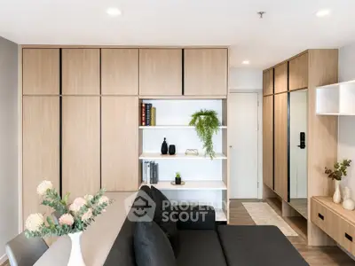 Modern living room with sleek wooden cabinetry and stylish decor