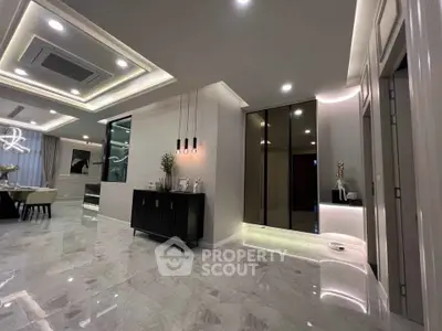 Luxurious modern living room with elegant lighting and marble flooring