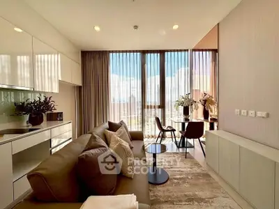 Modern living room with floor-to-ceiling windows and stylish decor in a high-rise apartment.