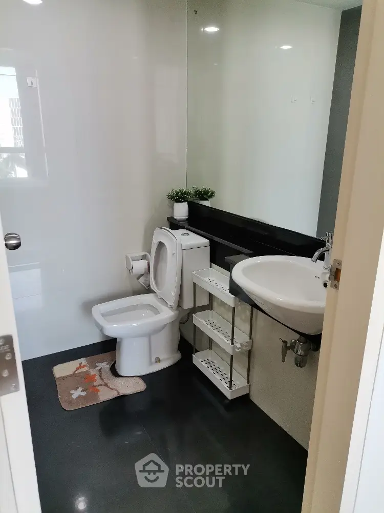 Modern bathroom with sleek design and elegant fixtures in a contemporary apartment.