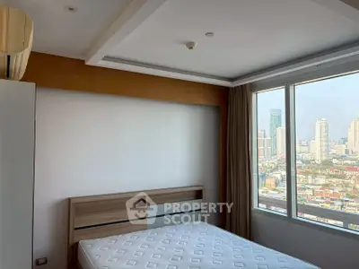 Modern bedroom with city view and natural light