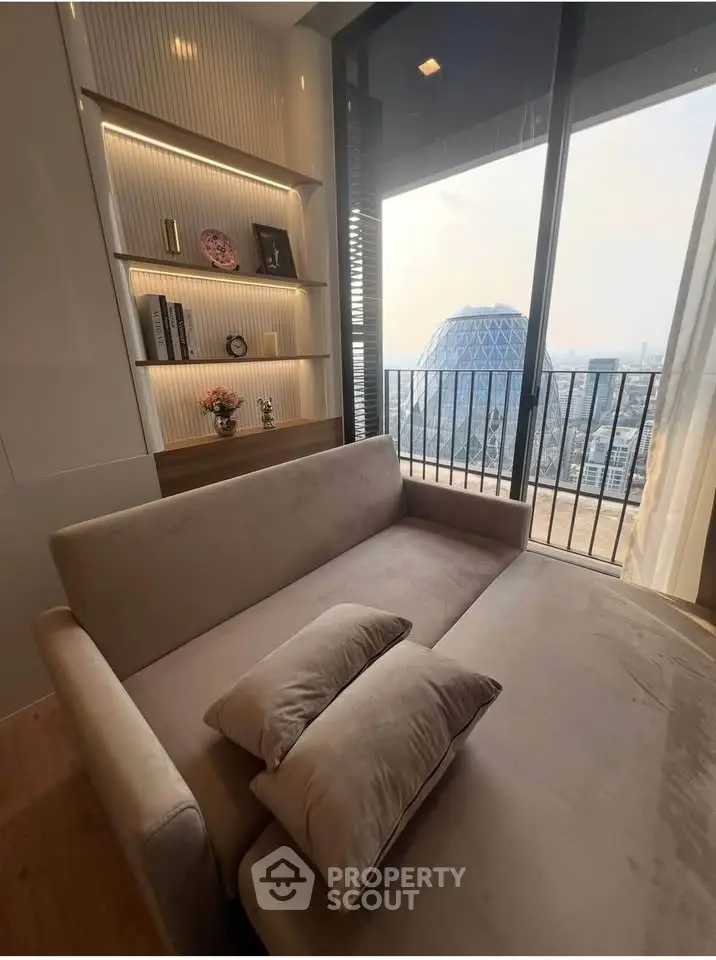 Luxurious living room with modern decor and stunning city view from balcony.