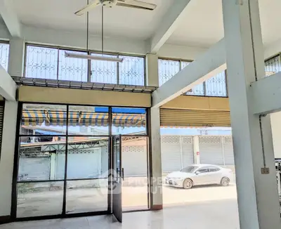 Spacious commercial space with high ceilings and large windows for lease.