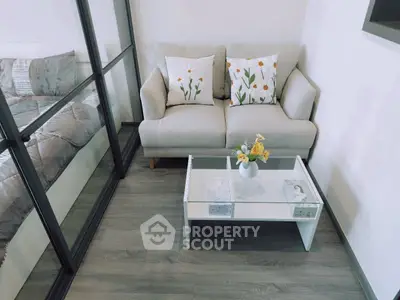 Cozy living area with glass partition and stylish decor