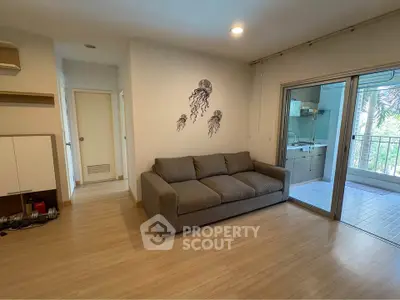 Modern living room with cozy sofa and balcony view in stylish apartment