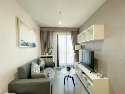 Modern living room with sleek furniture and large window view