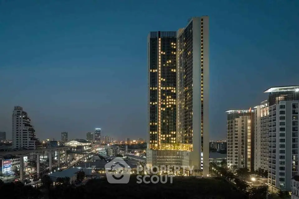 Stunning cityscape view with illuminated modern high-rise building at dusk.