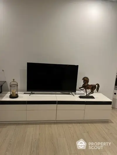 Modern living room with sleek TV stand and decorative accents