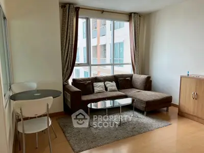 Cozy living room with modern furniture and large window view