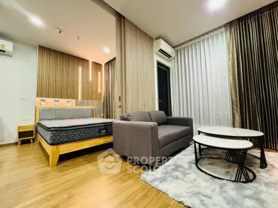 Modern studio apartment with cozy living area and stylish decor