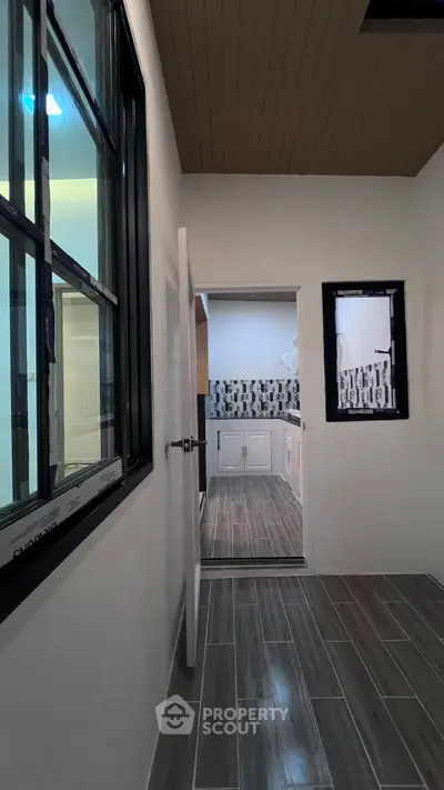 Modern kitchen with sleek tile flooring and stylish backsplash