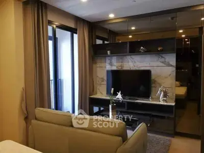 Modern living room with sleek design and balcony access in luxury apartment.
