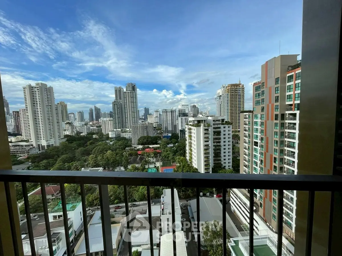 Stunning cityscape view from high-rise balcony in urban residential area.