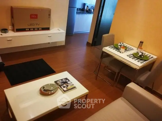 Modern living room with stylish furniture and LED TV setup, perfect for cozy evenings.