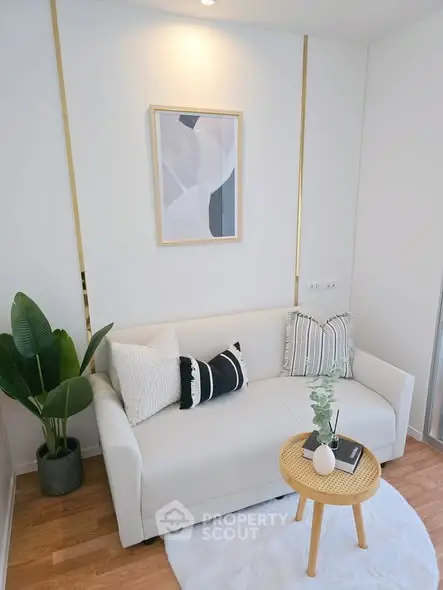 Chic modern living room with cozy white sofa and stylish decor