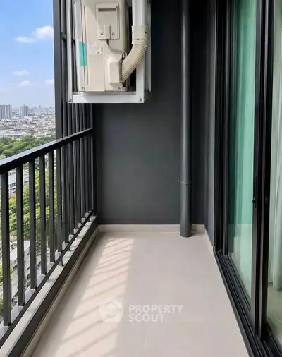 Spacious balcony with city view, perfect for relaxation and enjoying the skyline.