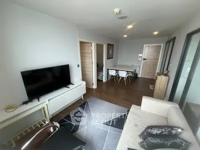 Modern living room with sleek furniture and stylish decor in a contemporary apartment.