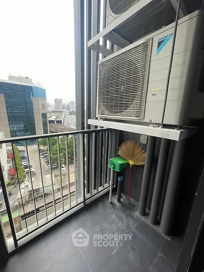 Modern balcony with city view and air conditioning unit, perfect for urban living.