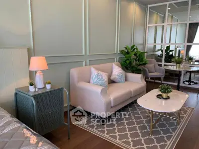Chic living room with elegant decor, cozy seating, and stylish coffee table, perfect for modern living.