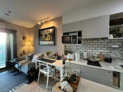 Modern open-layout living room and kitchen with stylish decor and natural light