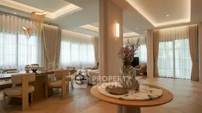 Luxurious open-plan living room with elegant decor and large windows