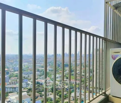 Stunning cityscape view from high-rise balcony with washing machine.