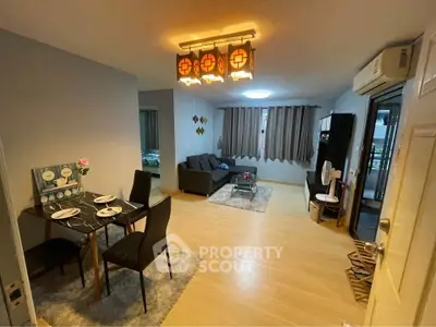 Spacious living room with modern dining area and cozy seating, perfect for entertaining.