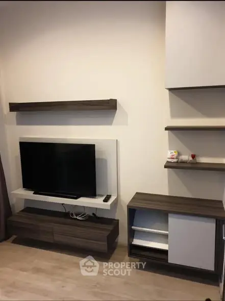 Modern living room with sleek TV stand and shelving unit