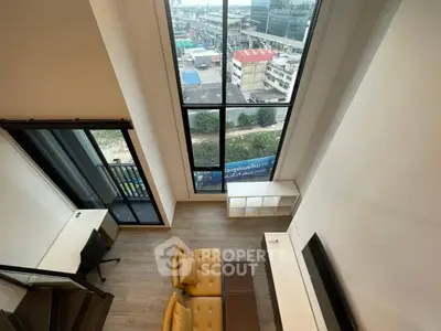 Stunning loft apartment with floor-to-ceiling windows and city view