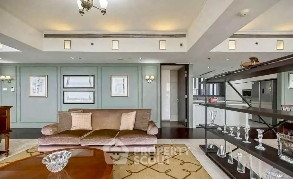 Luxurious living room with elegant decor and open kitchen layout in modern apartment.