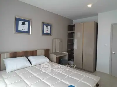 Modern bedroom with stylish decor and ample storage space