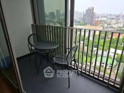 Chic urban balcony with city view, perfect for relaxation and enjoying the skyline.