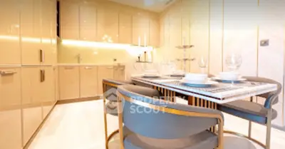 Luxurious modern kitchen with sleek cabinetry and elegant dining setup