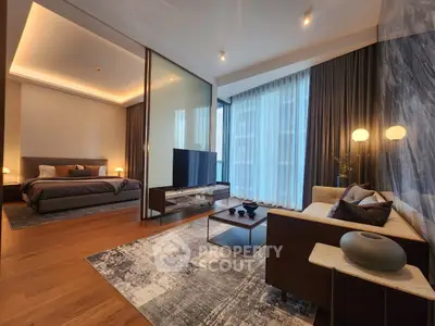 Luxurious modern living room with elegant decor and spacious layout, featuring a cozy bedroom view.